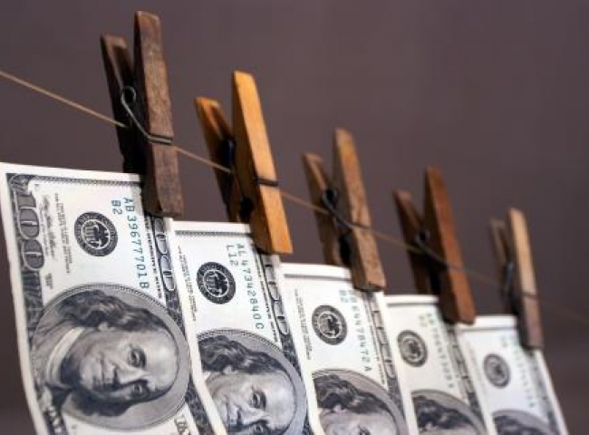 money hangs from a clothesline